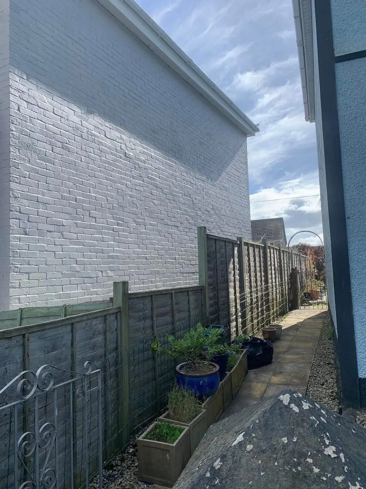 Freshly painted brick wall after preparation and masonry paint in Northam